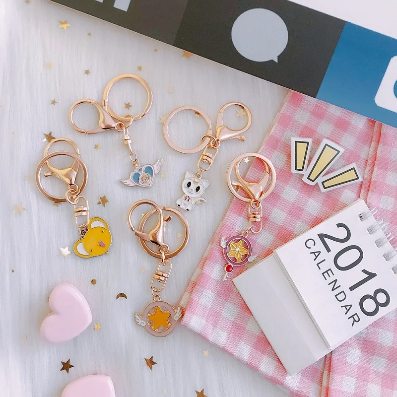 

Fashion Anime Magic Sakura Cartoon Keychain Personality Pink Fairy Magic Wand Heart Pendant Keychain Bag Pendant Gift Keyring