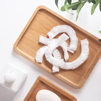 

Dropshipping 100pc shower caps disposable waterproof bath shower cap headgear dyed hair kitchen bath thickened and oil-proof cap