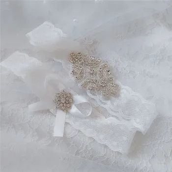 

Wedding Bridal Garter Set Crystal Rhinestone on a WHITE Lace crystal Toss Garter Set with Ivory Bow