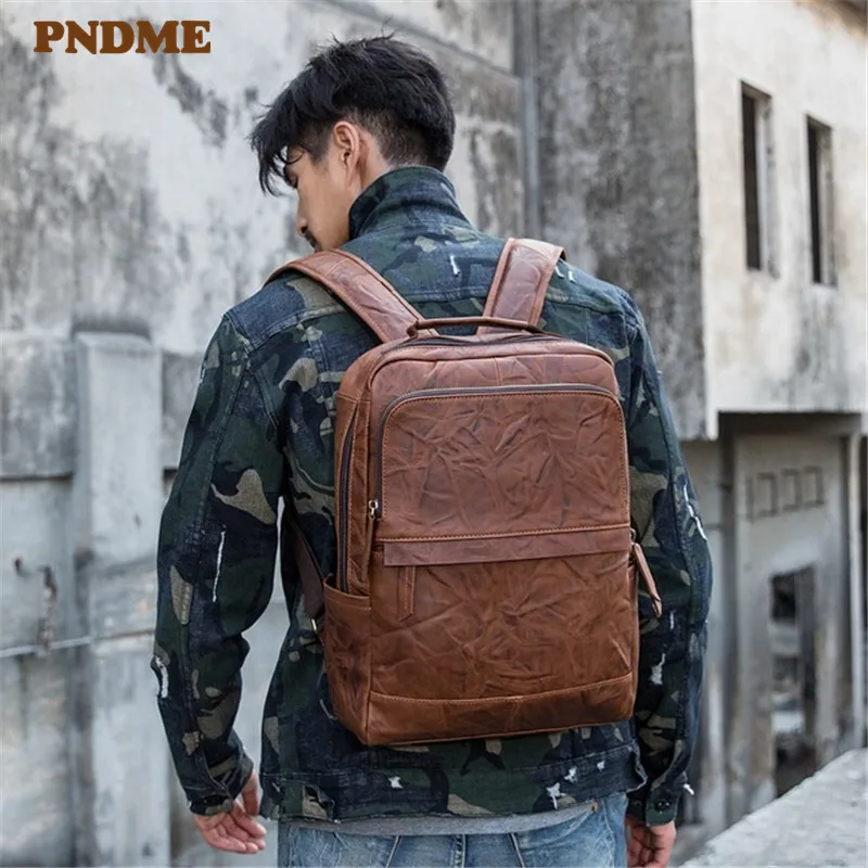 

PNDME casual vintage genuine leather pleated men's backpack high quality soft cowhide fashion teen travel laptop bagpack bookbag