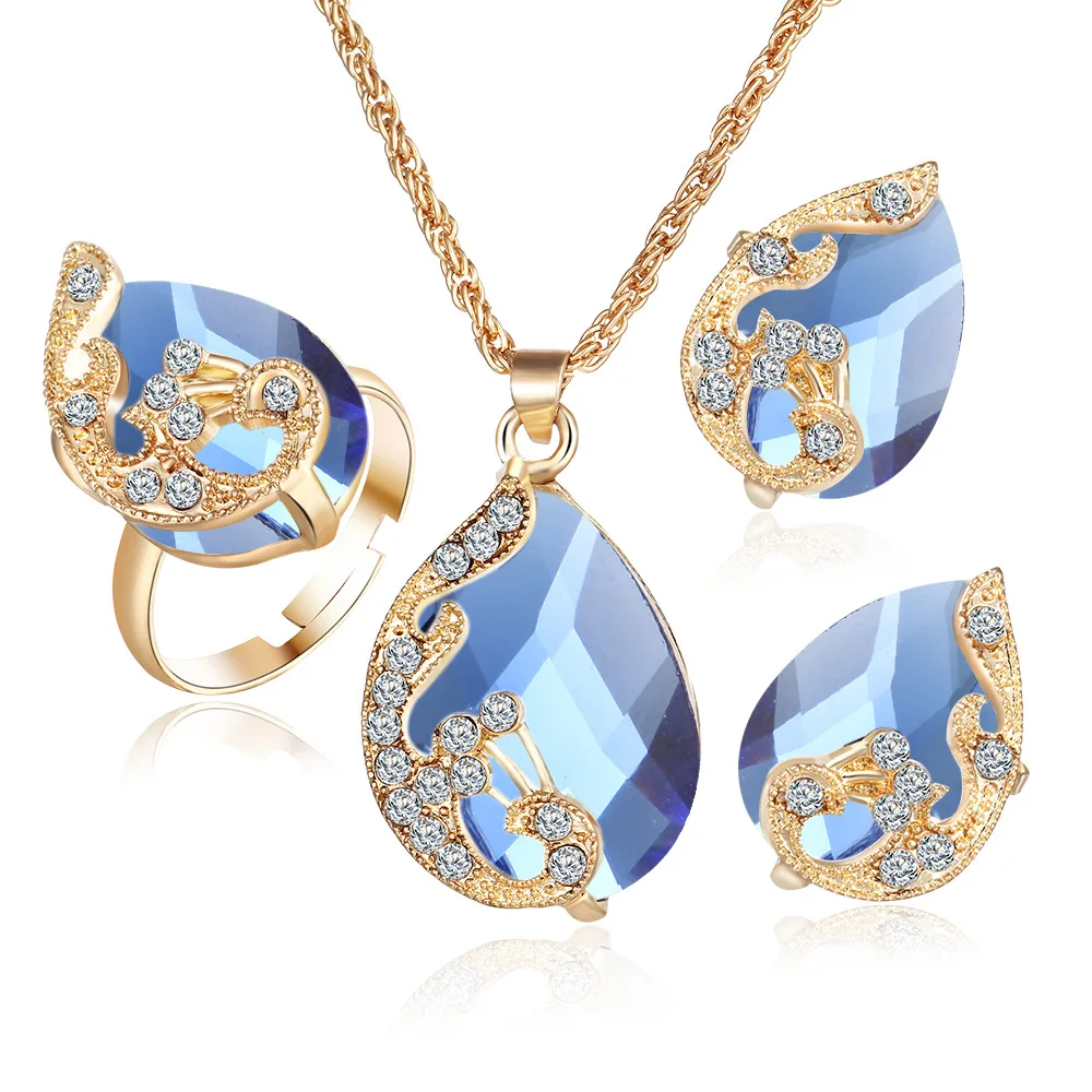 

Gold Plated Austrian Crystal Drop Peacock Three-Piece Pendant Necklace Ear Stud Ring Suit Female Jewelry Set Topaz Jewelry Sets