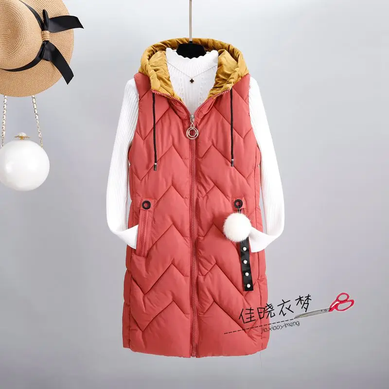 Утепленная теплая зимняя жилетка большого размера для женщин, новинка, милое длинное пальто без рукавов с помпоном, женская модная тонкая женская куртка с капюшоном