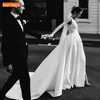 

Simple Boho Ivory V Neck Wedding Gowns Sleeveless Satin Pockets Side Slit A Line Wedding Dress Custom Made Beach Bridal Dresses