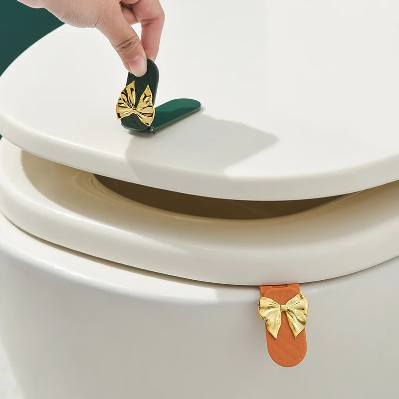 

1 Pcs Bow Toilet Cover Silicone Toilet Lid Lifter Household Bathroom Handle Flap Lifter Non Dirty Handle Artifact Lid Lifter