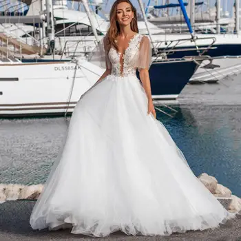 

Boho Beach Illusion A Line Wedding Dress Tulle Puffy Sleeve Sheer Button Back Long Bridal Gown New Arrival 2020