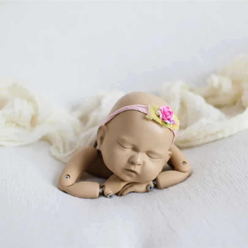 newborn photography posing doll