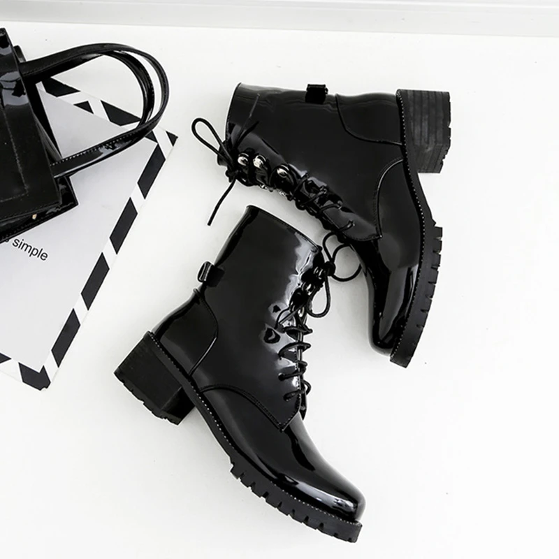 black flat tie up boots