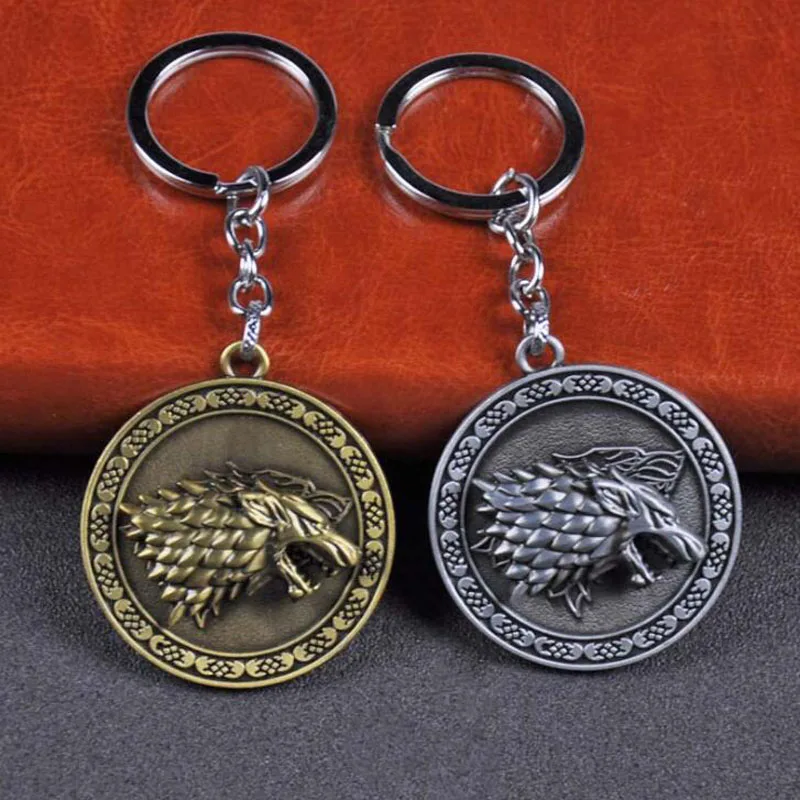 

10pcs/lot Fashion Jewelry Game.of.Thrones Keychains Stark Logo Wolf Head Rotate Keyring Creative Party Favors for Fans