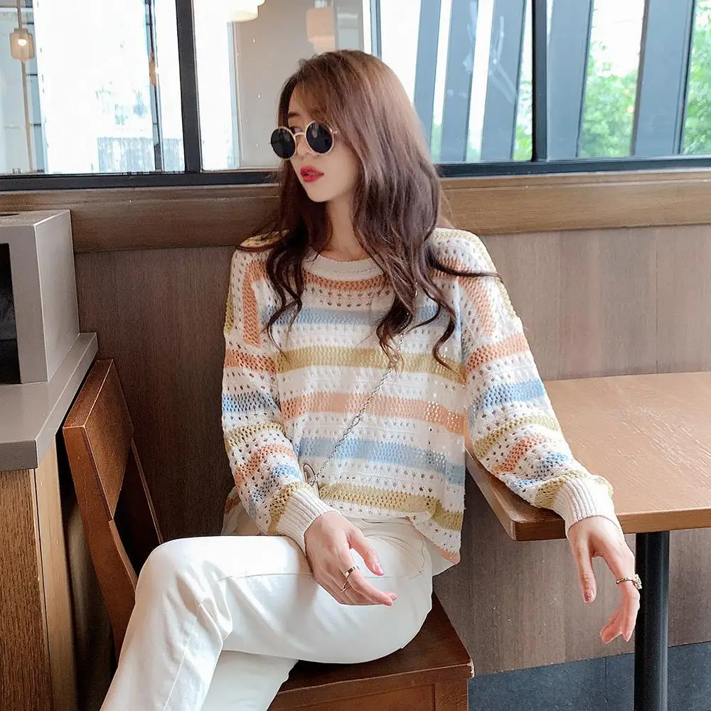 

Fall 2020 Women Korean Version of The Rainbow Striped Round Collar Hollow Loose Thin Women's Knitwear Long-sleeved Top.