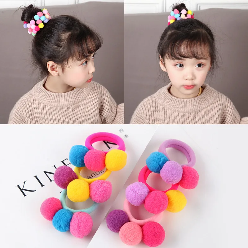 

The new Korean style colored pompoms girls hair accessories look like a little princess with the candy kawaii headband scrunchie