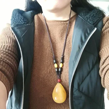 

Beeswax chicken oil yellow pendant necklace men and women temperament pendant ornament sweater chain long simple accessories