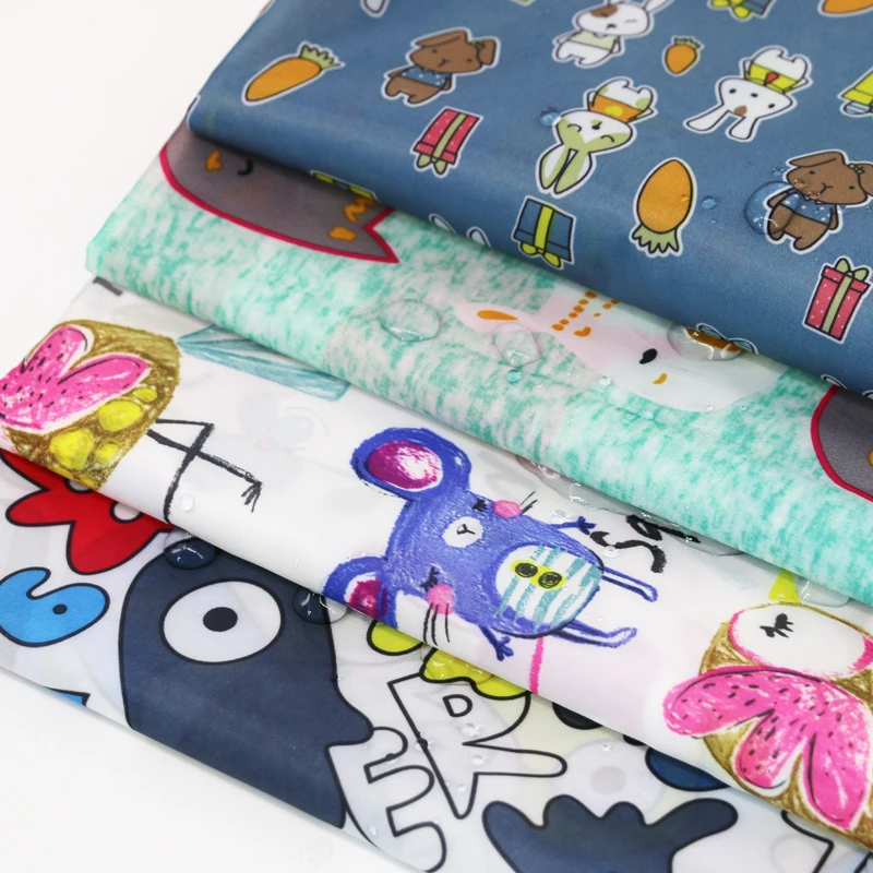 

100cm*148cm cartoon Print polyester taffeta fabric thin waterproof material for children raincoat Umbrella Tent
