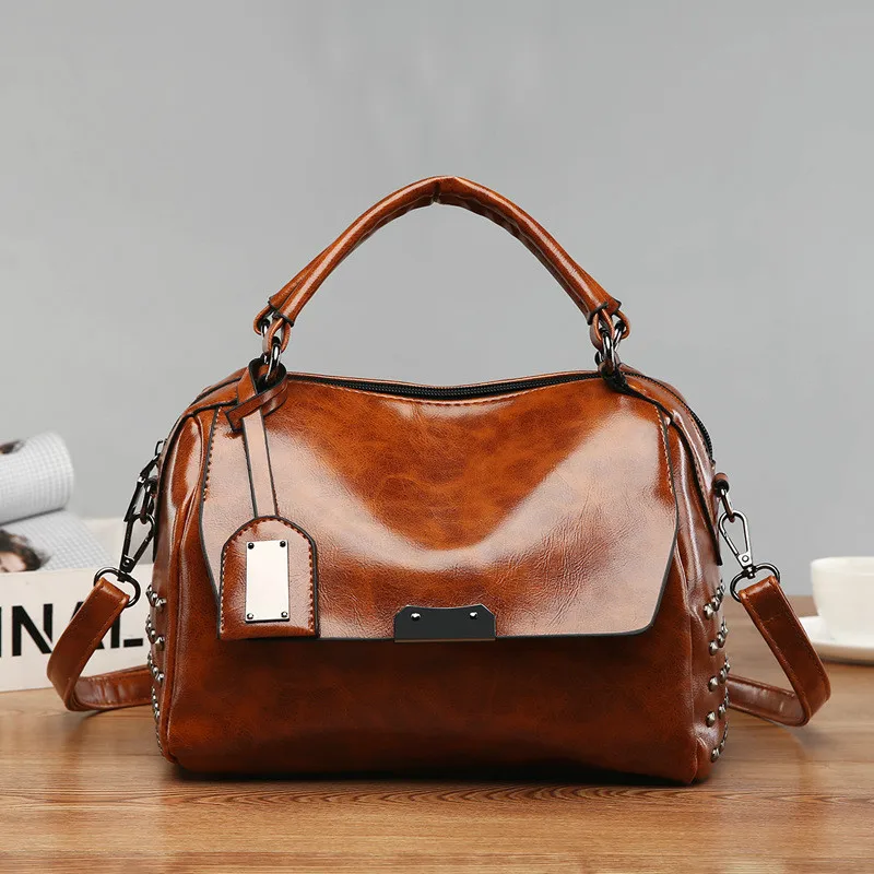 

2019 new high leather oil wax skin fashion wild handbag rivet decoration Boston handbag shoulder Messenger bag