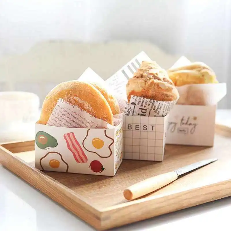 https://ae01.alicdn.com/kf/He102640c952c4da994425f715969ddf24/50PCS-Sandwich-Packaging-Paper-Box-Cake-Burger-Wrapping-Breakfast-Toast-Bread-Oilproof-Tray-Package-Pastry-Bakery.jpg