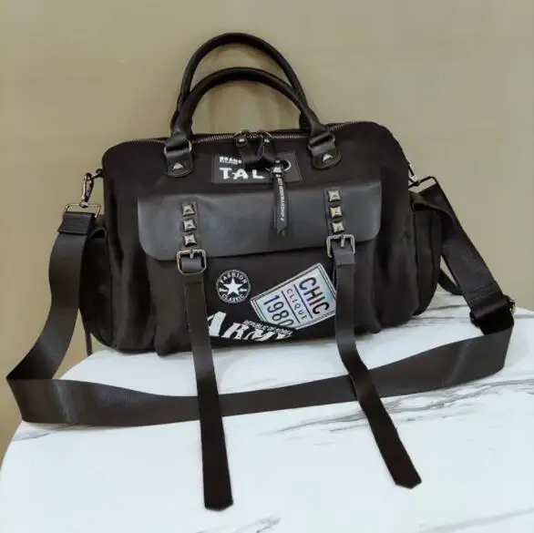 

Nylon 34with leather handbag personality rivet fashion multi-pocket travel bag large capacity shoulder bag