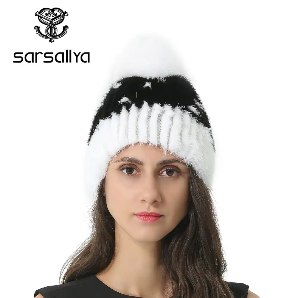 white winter hat with pom pom