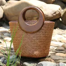 

Vintgae Rattan Straw Woven Bamboo Bag Wooden Round Top Handle Women Handbags Summer Beach Straw Bucket Tote Bags For Women 2021