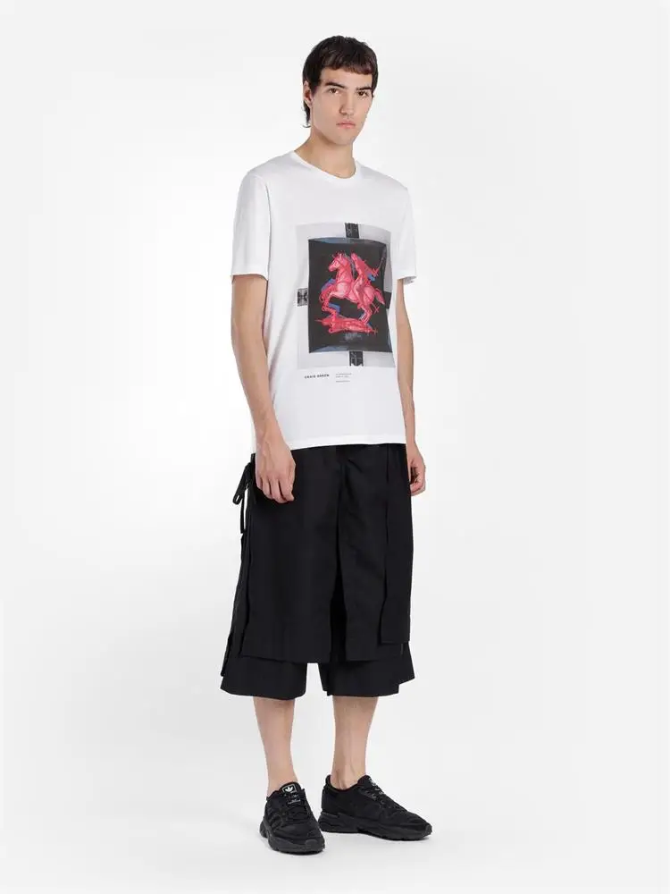 The new men\'s cropped trousers are dark and large size loose trousers with irregular asymmetrical wide legs