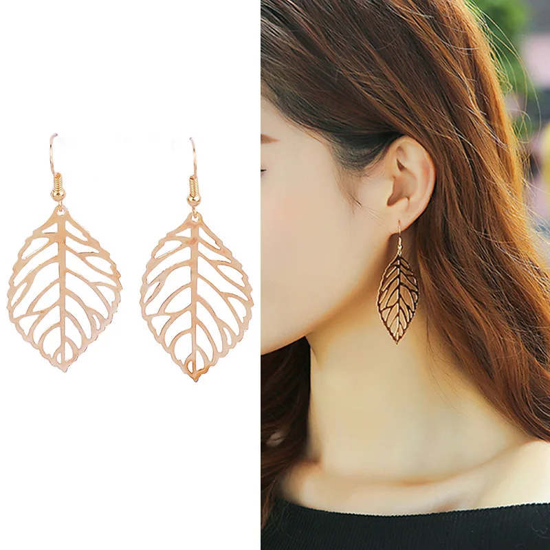HIYONG Pendientes Mujer Горячая Мода оптом полые металлические листья Висячие длинное