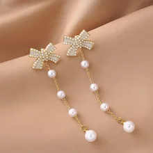 

2022 New South Korea Baroque Imitation Pearl Long Pendant Earrings Fashion Simple Swing Bowknot Earrings Women Jewelry Gifts