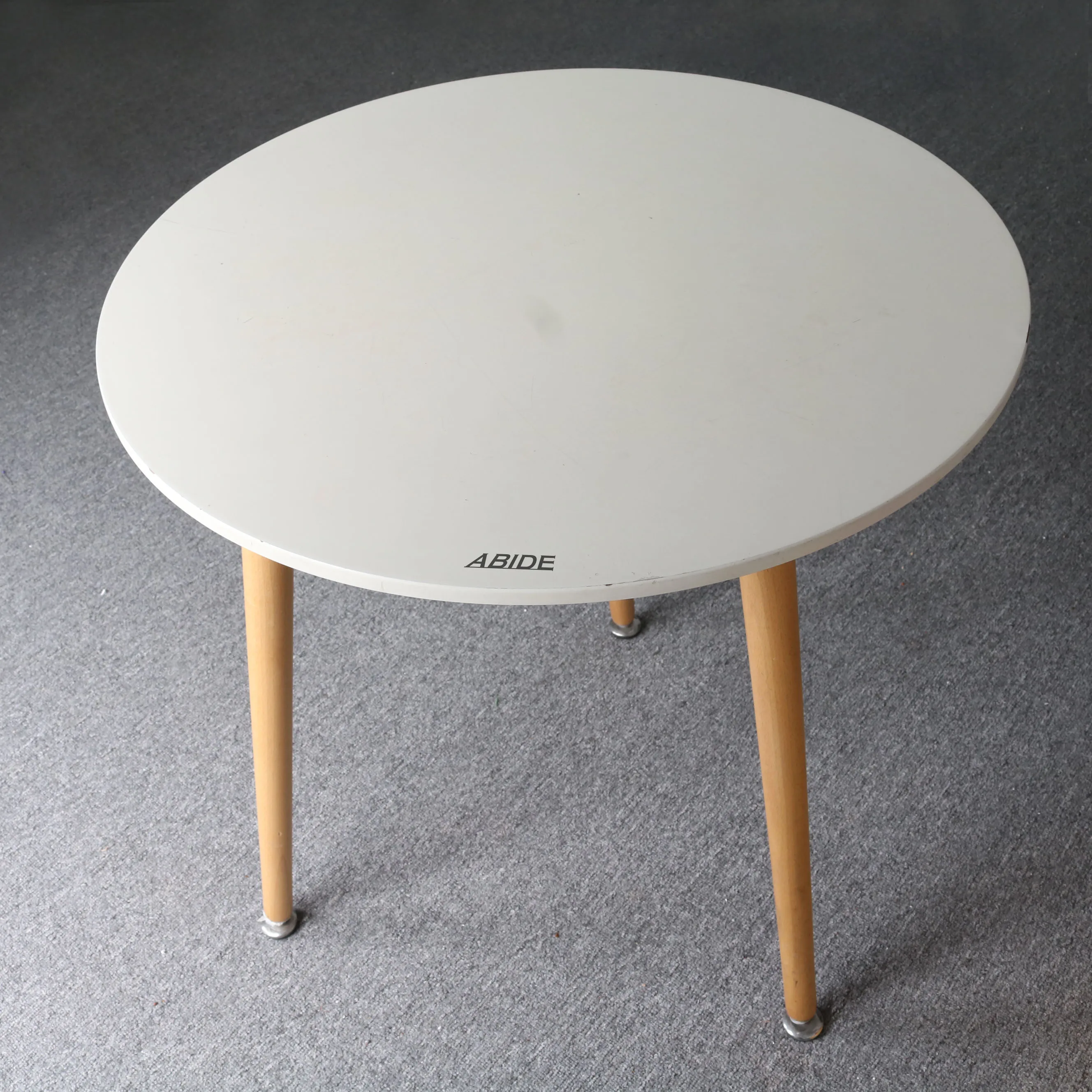

abide White round table with three legs