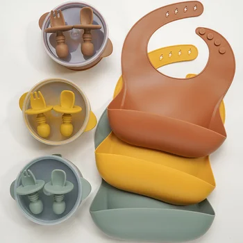 

4pcs Silicone Baby Bibs Tableware Set New Products Toddler Sucker Bowl With Lid Solid Color Soft Baby Silica gel Fork Spoon