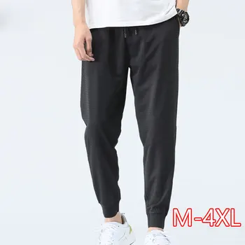 

Men Quick-drying Bottom Pants Summer Casual Men New Loose Casual Trousers Hollow Drawstring Elastic Waist Mesh Harem Pants 2020