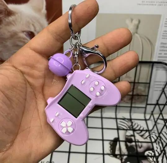 Retro Console Game Keychain Built-In 7 Games Puzzle Video Game Mini Handheld Game Console Pendant New Year Xmas Gift For Kids 