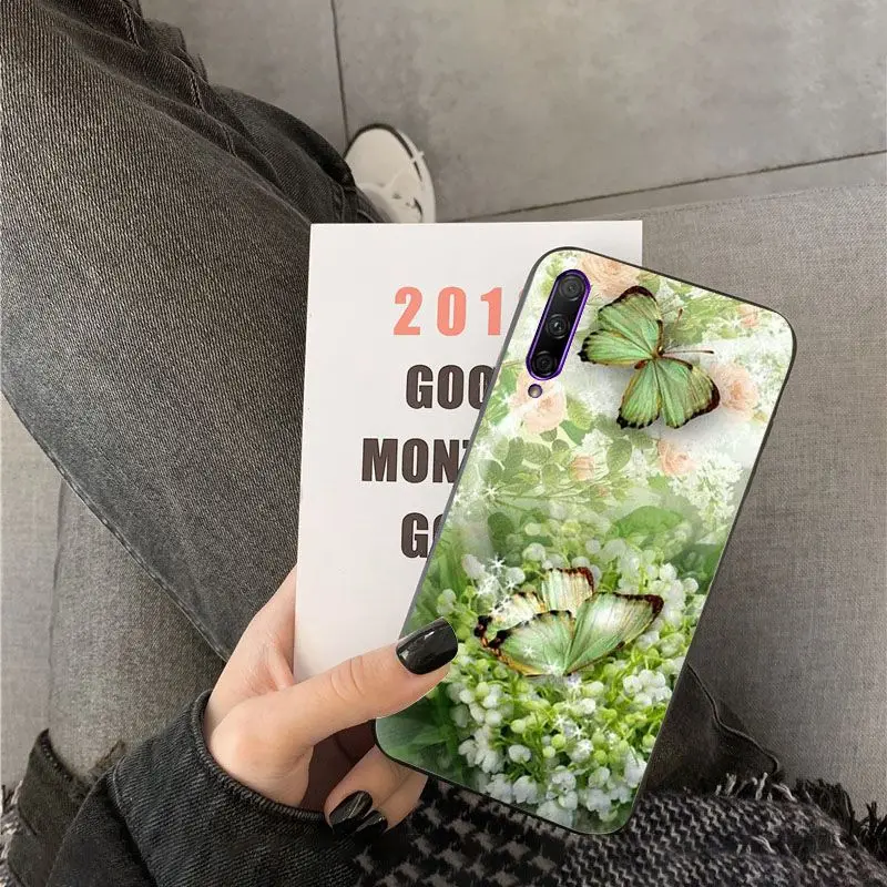 Red butterfly on white roses flower