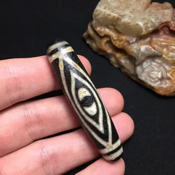 

Natural Tibetan agate dzi large size Natural Grease Lubrication Wrapped slurry Weathered Pattern Buddha eye size 68×15.5mm