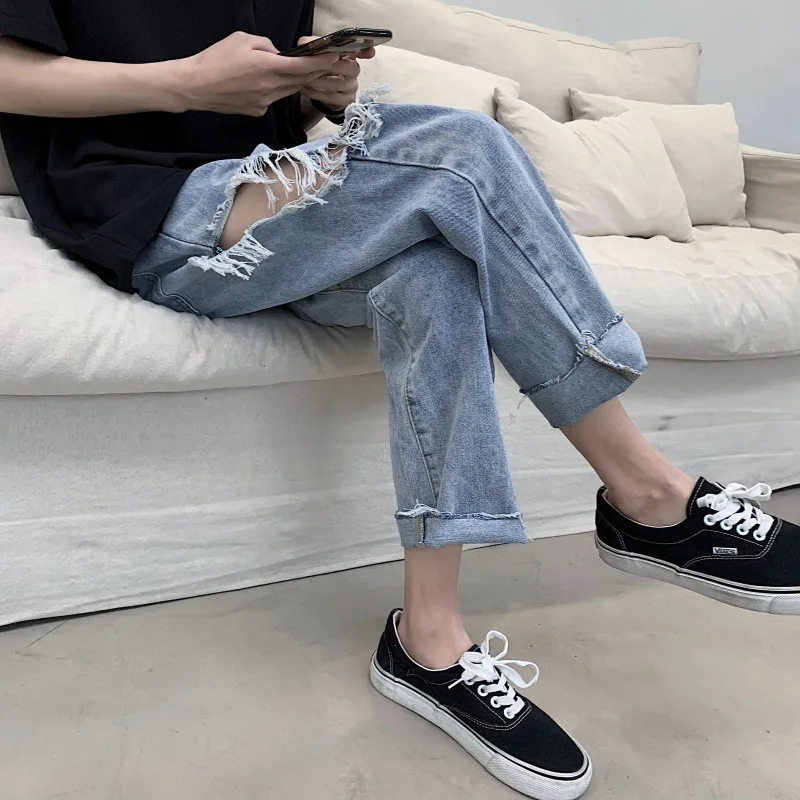 Ripped jeans men's straight loose-fitting trend Korean version of the summer thin nine-point wide-legged pants.