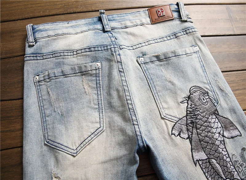 Осень зима мужские лоскутные рваные вышитые Стрейчевые джинсы модные прямые джинсы с дырками