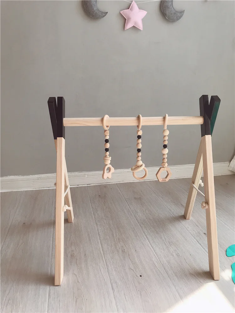 

Nordic Wooden Baby Gym with three Rattles Play Nursery Early Education Wooden Toy Activity Frame