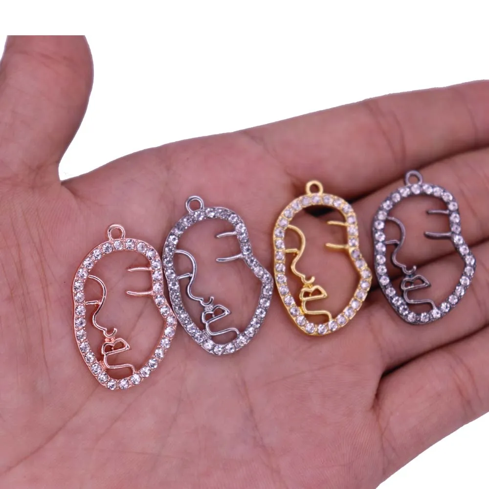 

Custom Design Novelty New Arrival Metal Alloy Rhinestone Crystal Face Charm Hollow Human Face Jewelry