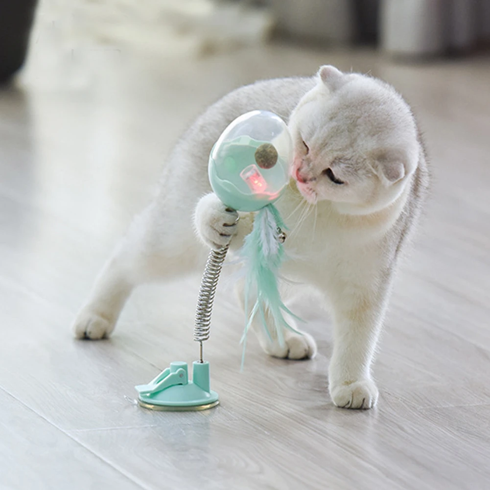 

Cat Teaser Toy Plastic Cats Interactive Toy With Bottom Sucker Elastic Spring Feather Bell Kitten Training Leakage Food Toy