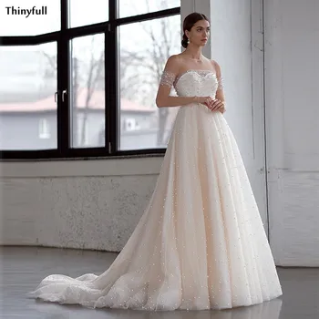 

Thinyfull Champagne Wedding Dresses Boho Pearls Beaded Illusion Beach Wedding Party Gowns With Full Sleeve Vestidos De Novia