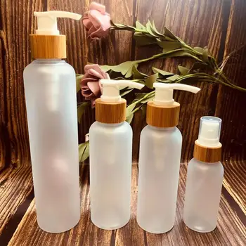 

Natural bamboo bottle empty cosmetic PET bamboo bottle lid 250ml 500ml Amber frosted clear Bamboo Body Lotion Pump PET Bottle