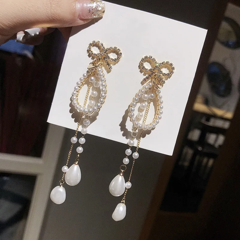 

Dominated 2019 personality exaggerated style crystal Bowknot Women Drop earrings Long pearl tassel joker fine earring Jewelry