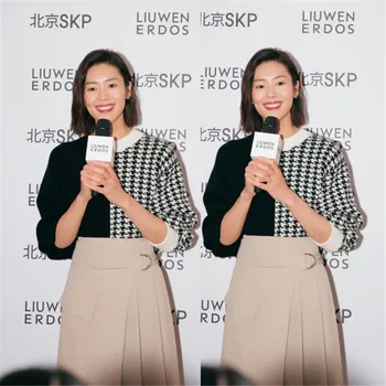 

Lady's asymmetric pattern half white half black striped Pullover women's autumn and winter