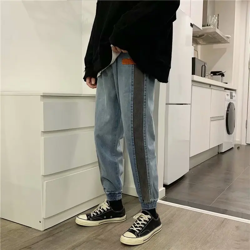 Primavera nueva universidad viento hombres повседневные tendencia джинсы recta gran bolsillo personalidad costura joven Популярные fiesta
