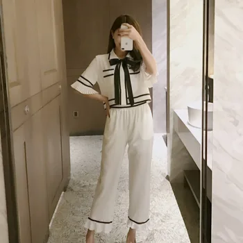 

Women's suit 2020 summer new temperament pleated short-sleeved top + slim nine-point pants female two-piece suit