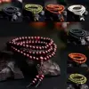 Pulseras budistas de madera de sándalo Natural para hombres y mujeres, nudo de cuentas de oración de Buda, pulseras y brazaletes de ébano negro