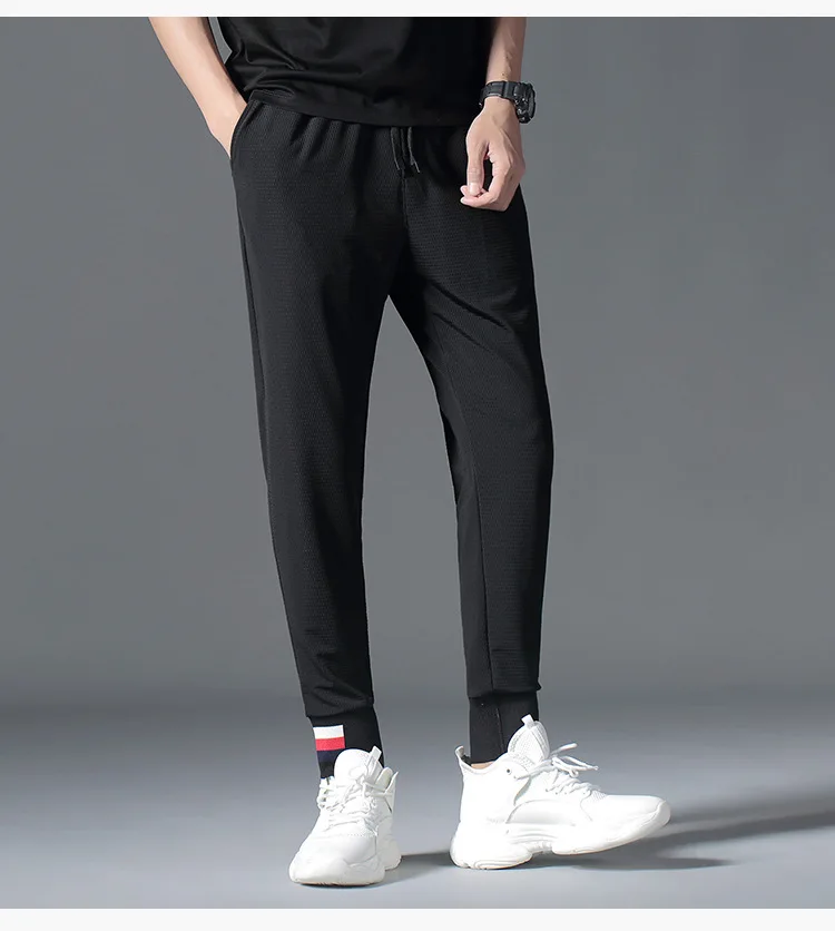 Autumn Black Hollow Out Mens Pants Loose Drawstring Sports Pants Streetwear Fashion Designer Joggers Calca Masculina