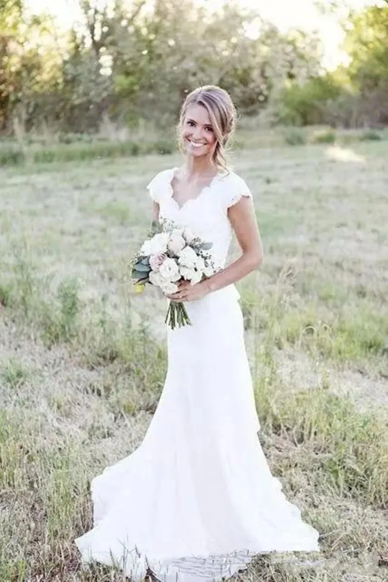 Elegante Land Trouwjurken Lace V-hals Cap Sleeve Modest Bruidsjurken Boho Beach Vestido De Noiva Bedekt Knop Elegante Land Trouwjurken Lace V-hals Cap Sleeve Modest Bruidsjurken Boho Beach Vestido De Noiva Bedekt Knop