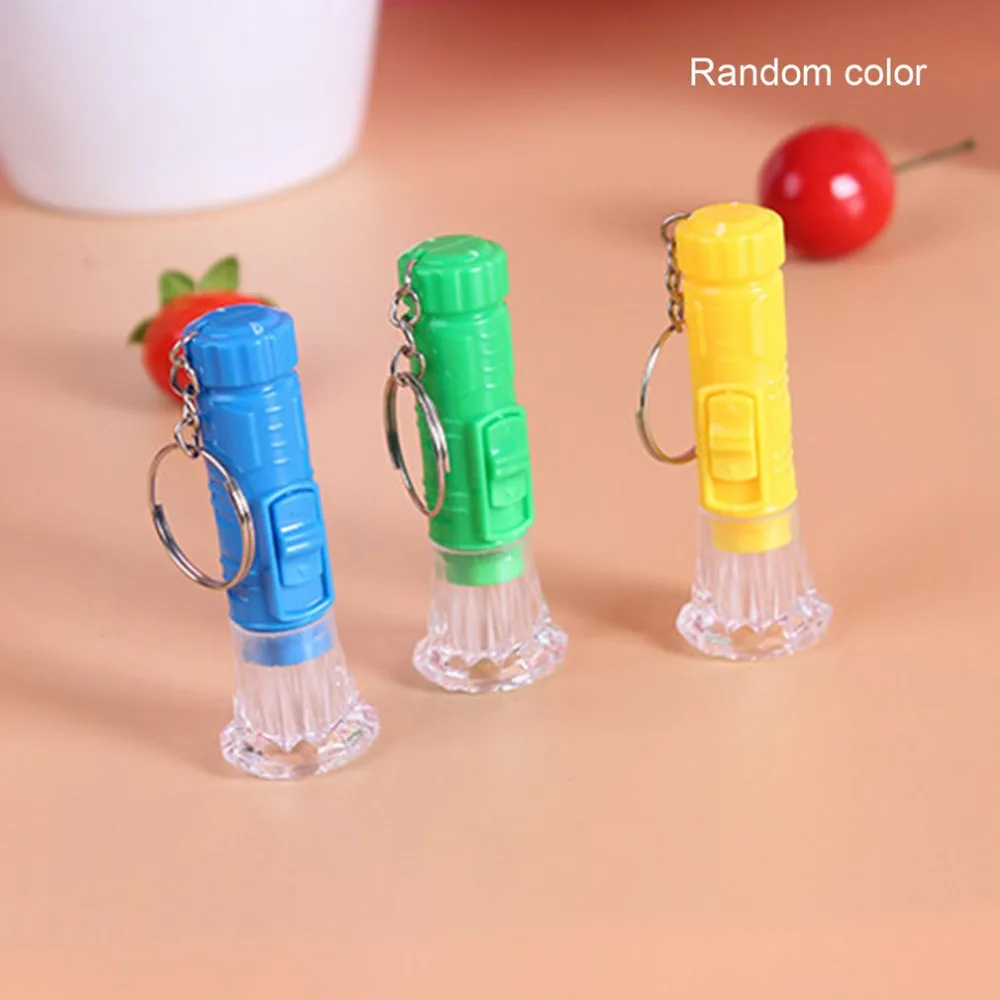 1PC Mini Plastic Hand Torch Portable Keyring Super Bright LED Flashlight Button Cell Powered Flash Light (Random Color)