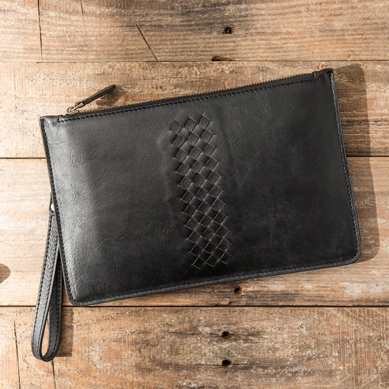 black woven clutch bag