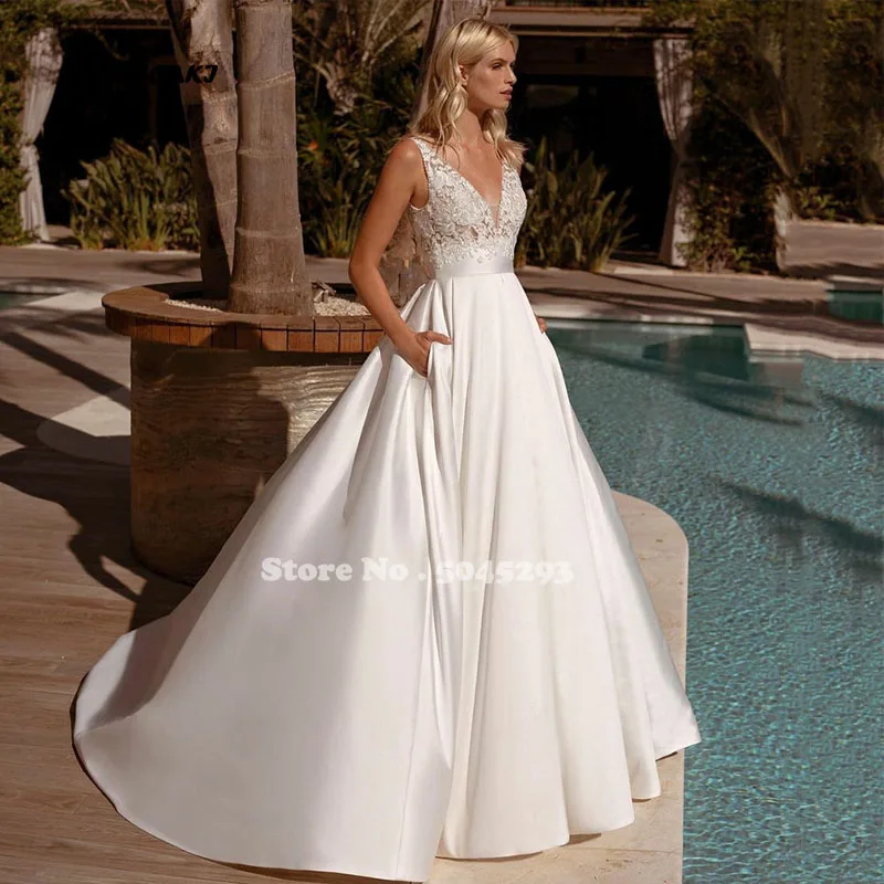 

Женское платье с карманами, V-образным вырезом и открытой спиной