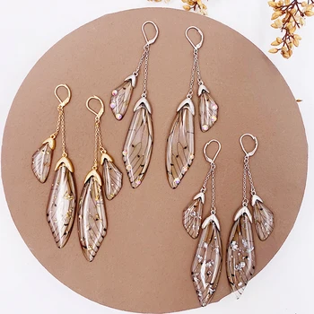 

Fairy Resin Butterfly Earrings for Women Shining Crystal Flake Double Wing Long Drop Earrings Ladies Wedding Party Jewelry 2020