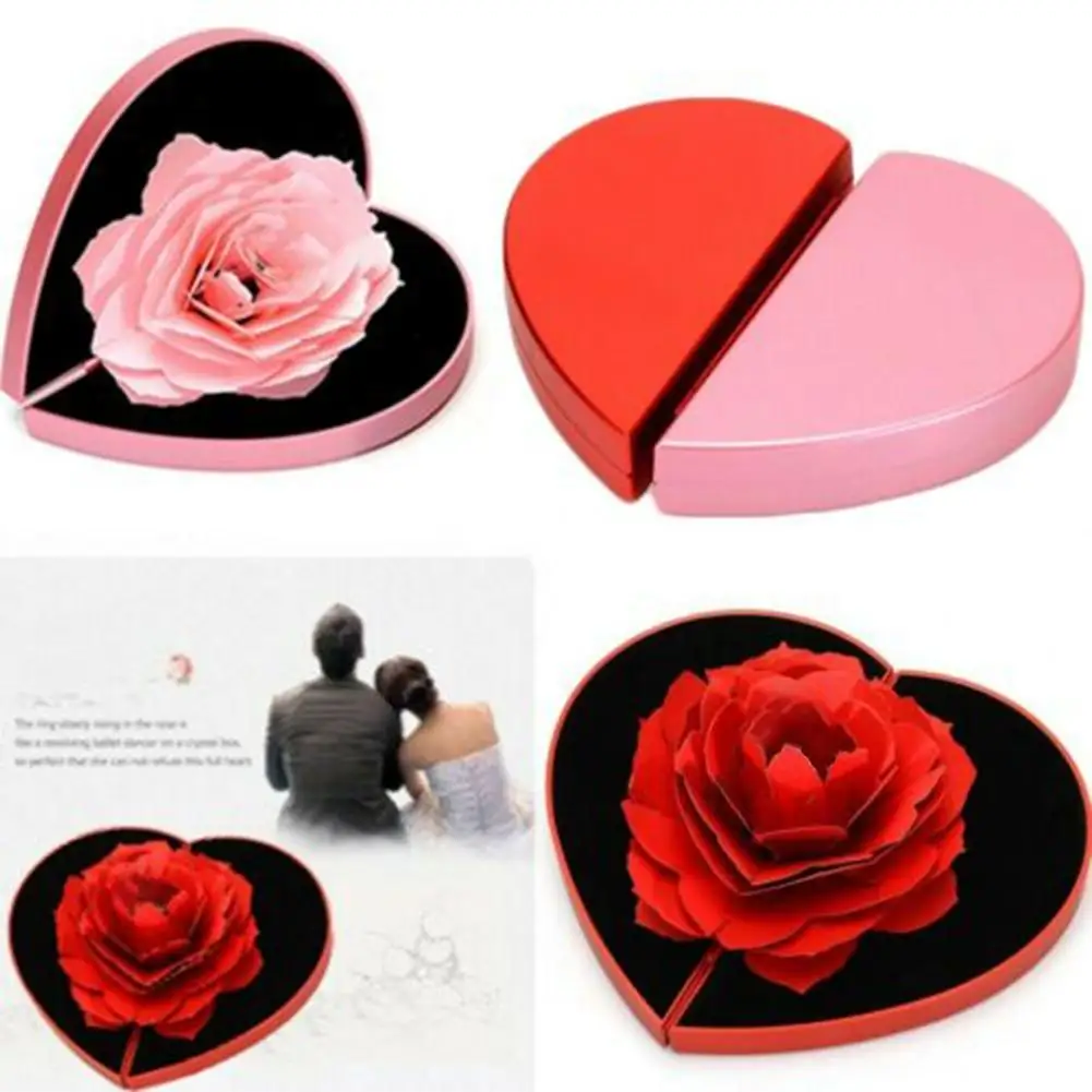 

Heart-shaped rotating rose lifting proposal box