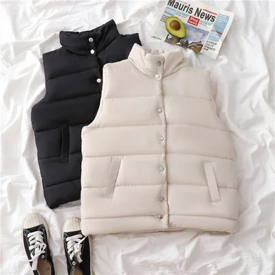 

Padded Vest In Quilted Fabric. Stand-up Collar, Snap Fasteners At Front , and Diagonal Welt Front Pockets. Winter Warm